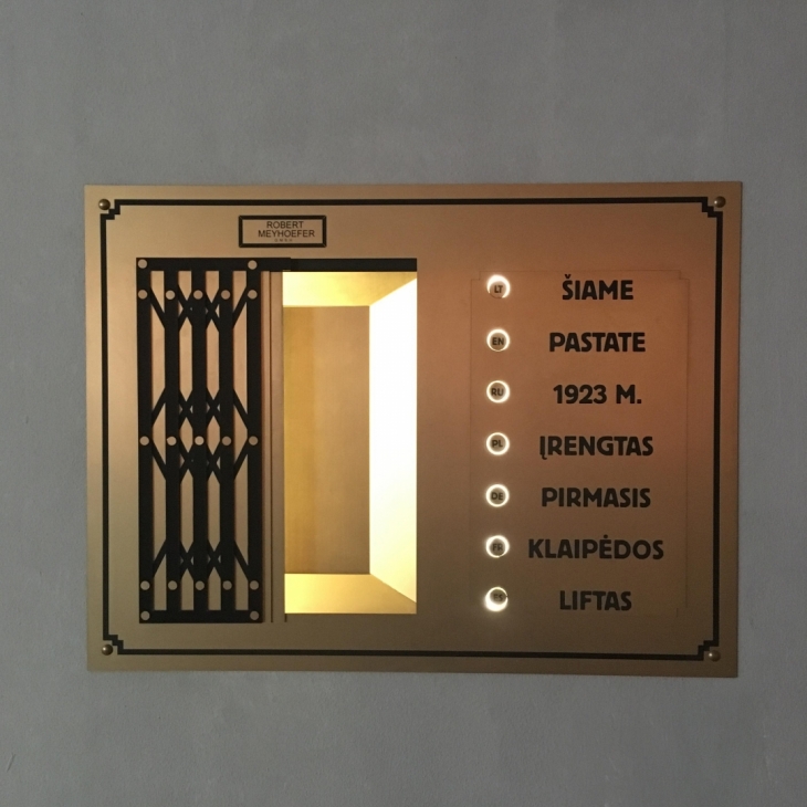 The memorial board for the first elevator in Klaipėda by Haroldas Grigaliūnas
